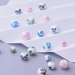 Kép 2/5 - Virág mintás porcelán gyöngyök vegyesen dobozban (8-12mm)/140db