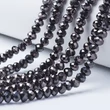Kép 1/2 - Csiszolt galvanizált fekete üveggyöngy szálban (8x6mm) /63~65db