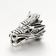 Kép 1/2 - Antikolt ezüst színű sárkány fej alakú gyöngy (17x11mm)