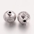Kép 1/2 - Antikolt ezüst színű szív mintás golyó alakú gyöngy (6mm)/4db