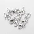Kép 1/6 - 10db Antikolt ezüst színű delfinkapocs (14x8mm)