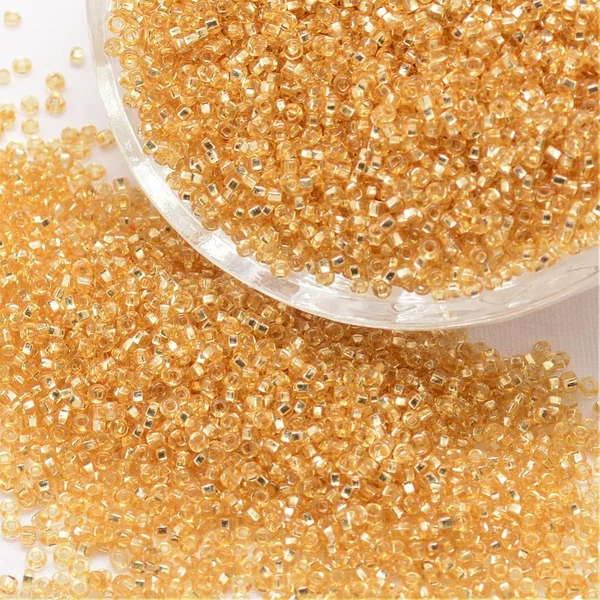 Arany színű belül ezüst kásagyöngy (12/0)