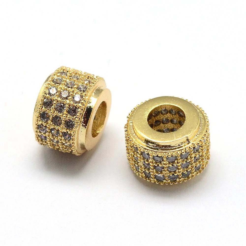 Strasszal díszített arany színű cirkónia gyöngy (9x7mm)