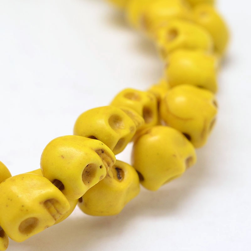 Szintetikus howlit sárga koponya gyöngy (9x7,5mm)