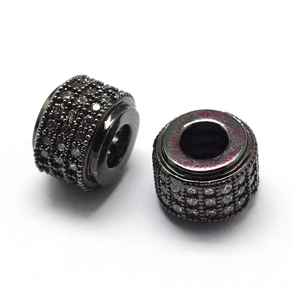Strasszal díszített fekete színű cirkónia gyöngy áttetsző kövekkel(9x7mm)