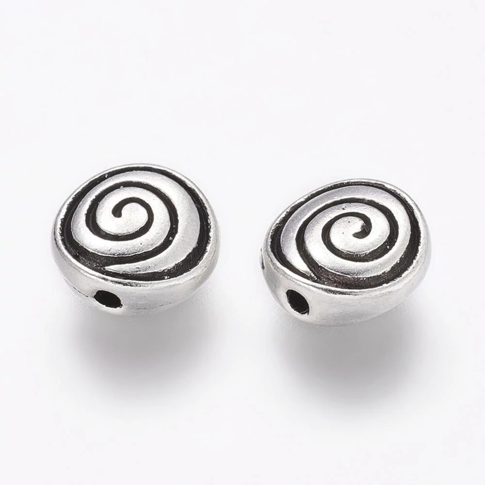Antikolt ezüst színű csigavonalas  lapított gyöngy (8x4mm)/4db