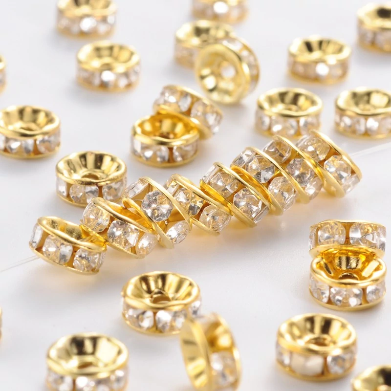 10db arany színű strasszos köztes (8x4mm)