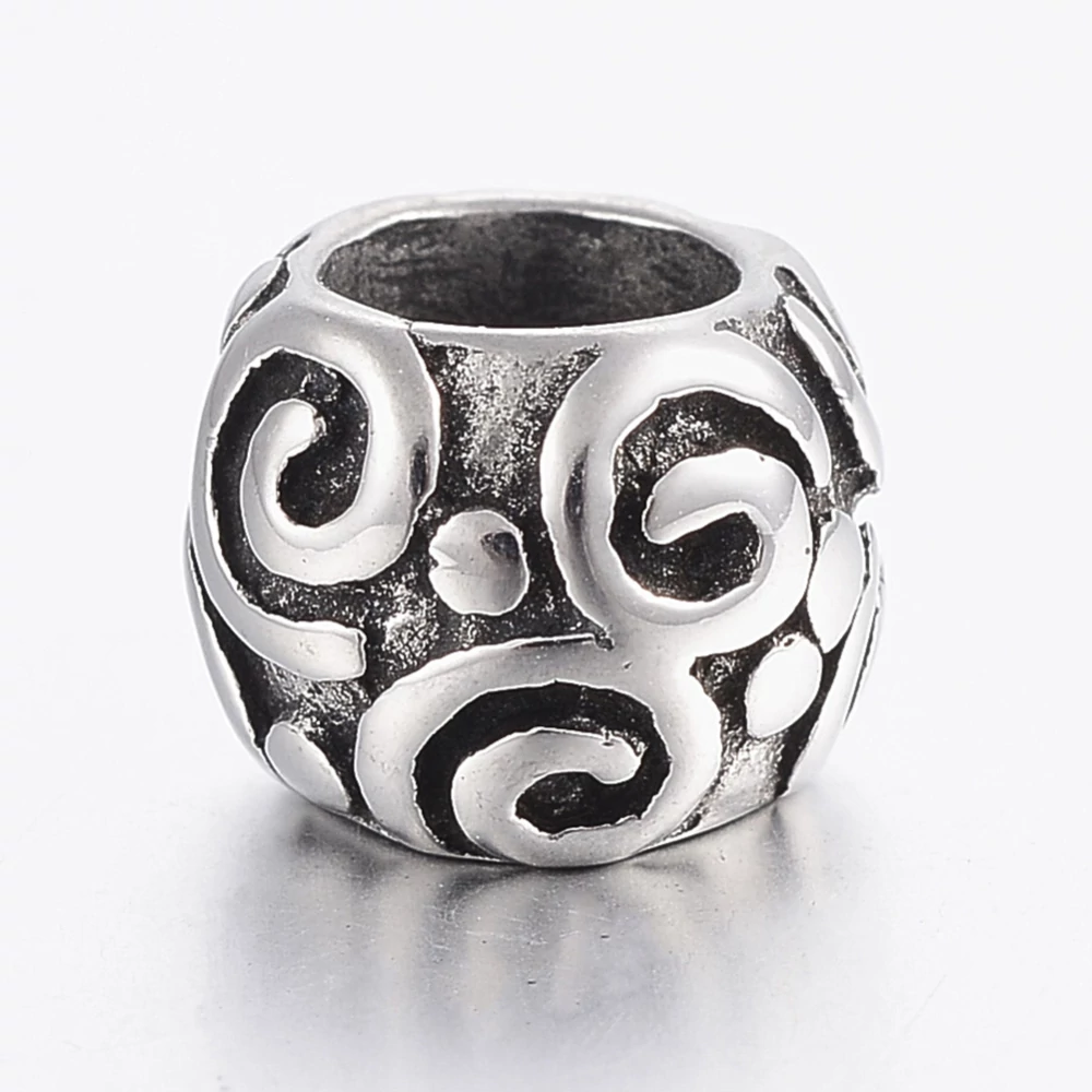 Nemesacél csiga mintás gyöngy (10x8mm)