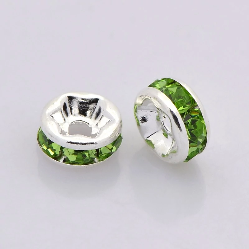 10db ezüst színű világos zöld strasszos köztes (8x4mm)