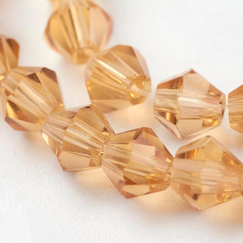 10db Arany bicone üveggyöngy (4mm)